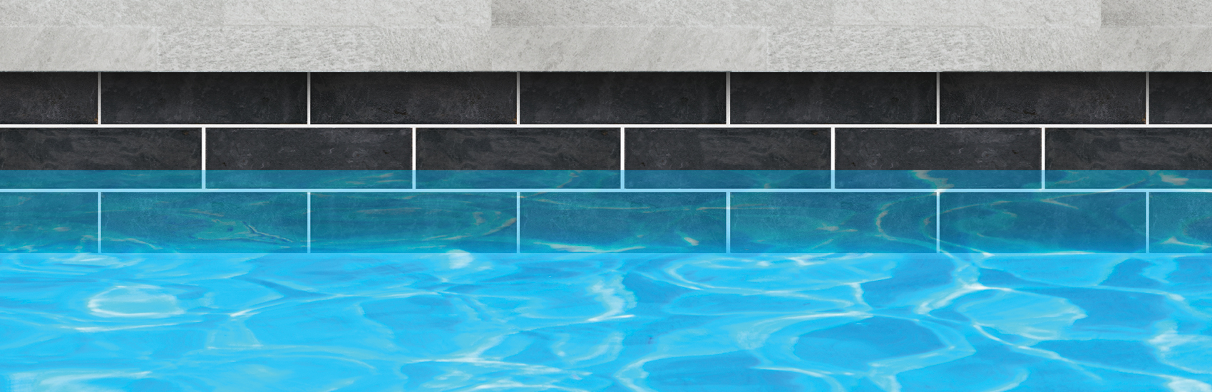 dark stone waterline tile above bright blue water